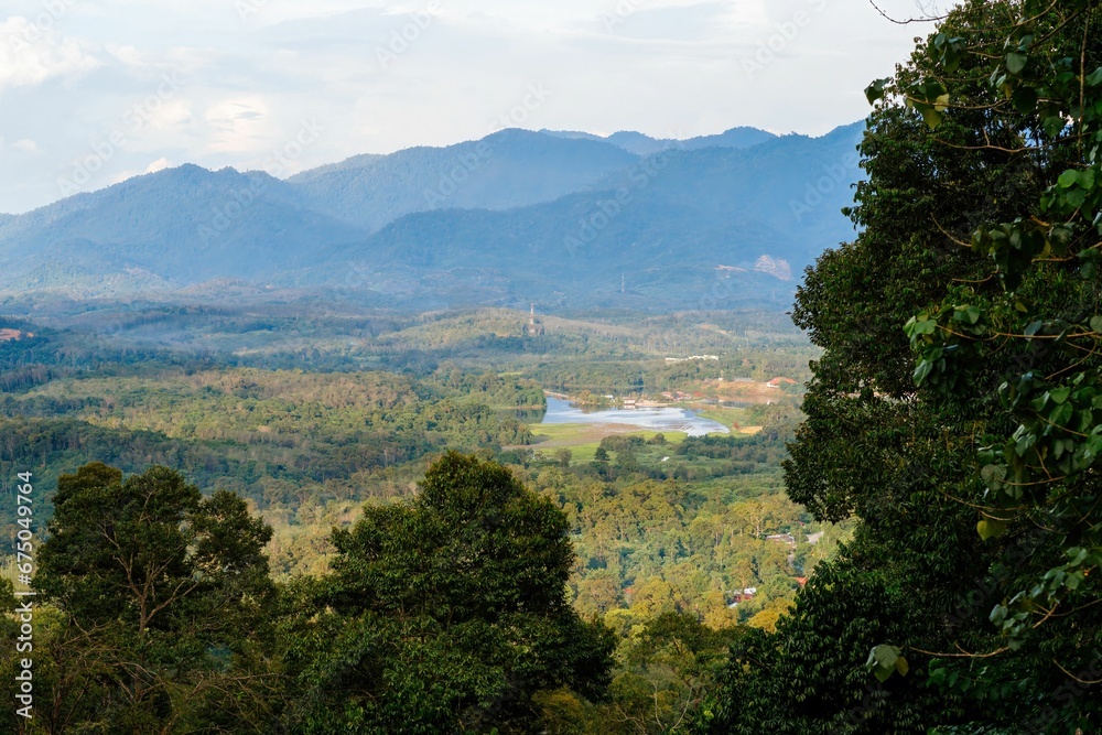 In Lenggong, Malaysia, an aerial view of tropical rainforest near the mountains.