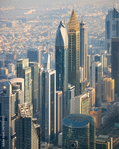 Photography Aerial shot of bustling modern cityscape featuring multiple tall skyscrapers in Dubai, UAE