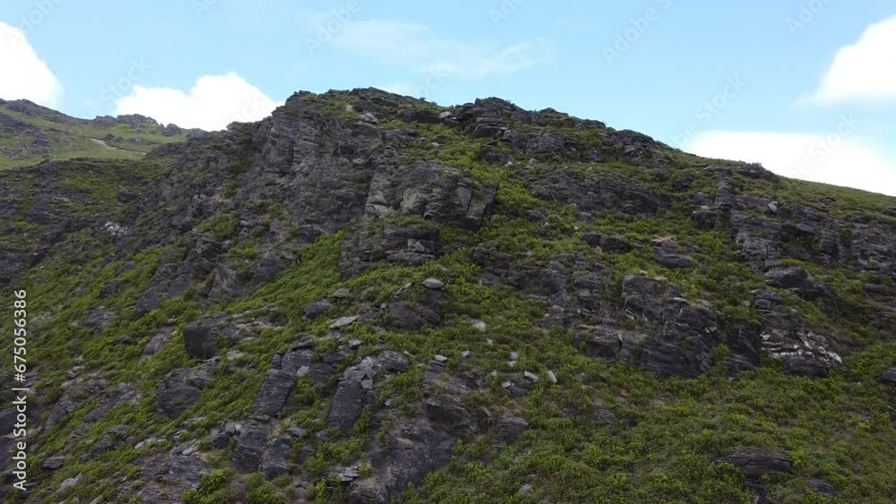 Beautiful view of canyon of green hills on a sunny day