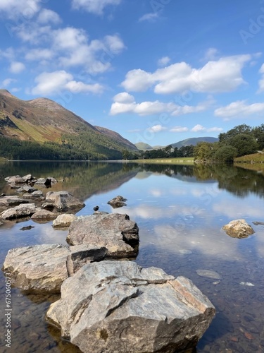 Tranquil scene of a serene lake surrounded by rocky terrain