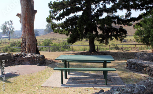 Picnic table bench and trees at EM Tilley Park near Rathdowney in Queensland, Australia photo