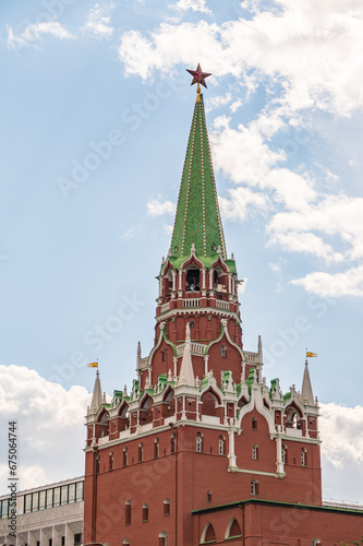 Troitskaya tower of Moscow Kremlin on a blue sky background in sunny summer day