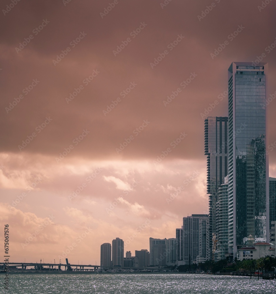 Stunning image of a city skyline featuring modern skyscrapers against a dramatic sky on a cloudy day