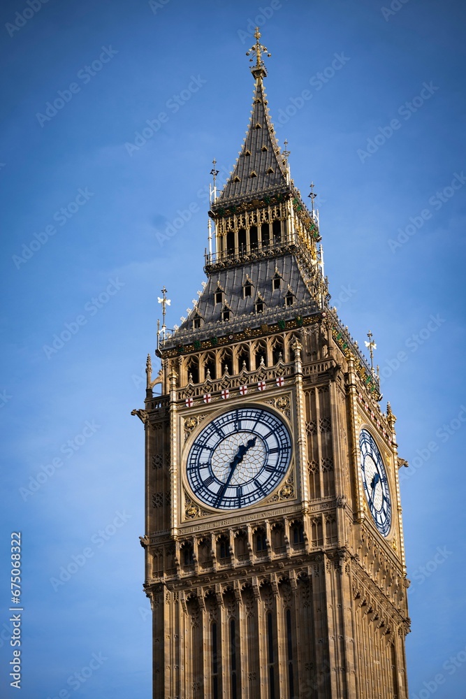 Vertical of Big Ben against the blue sky in London, England, UK