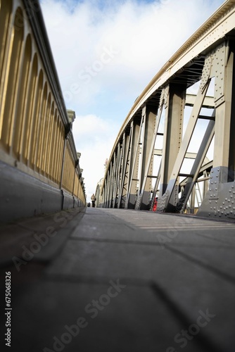 Vertical of a metallic bridge on a cloudy day