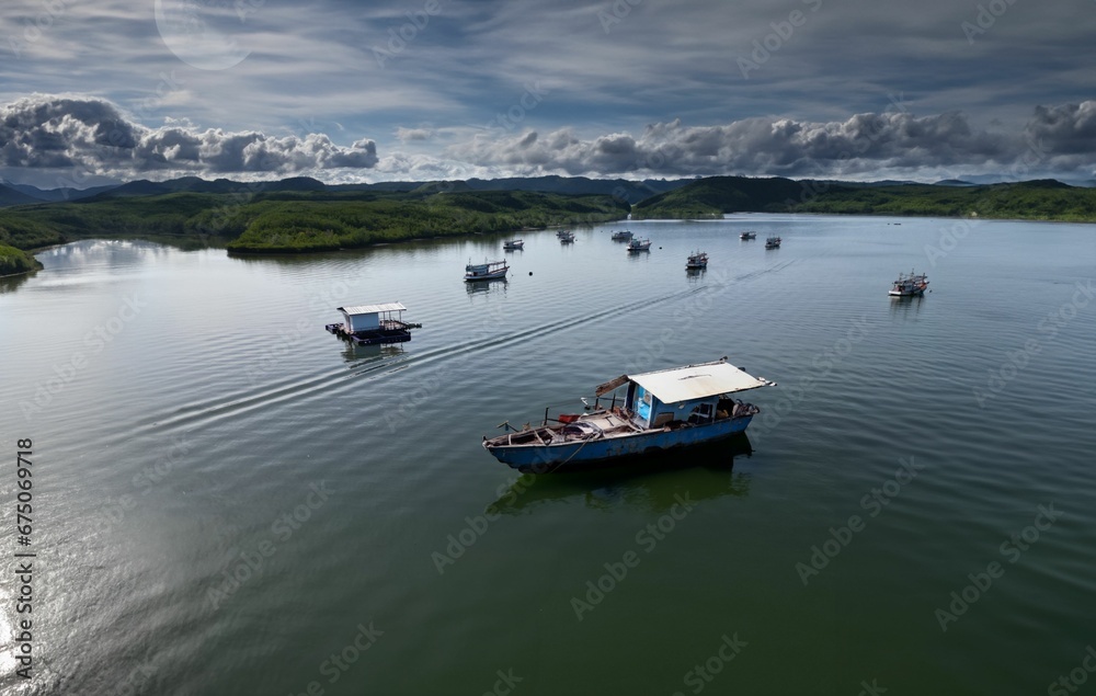 Stunning aerial view of Phang-Nga Bay in Phuket, Thailand, with a fleet of traditional boats