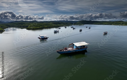 Stunning aerial view of Phang-Nga Bay in Phuket, Thailand, with a fleet of traditional boats