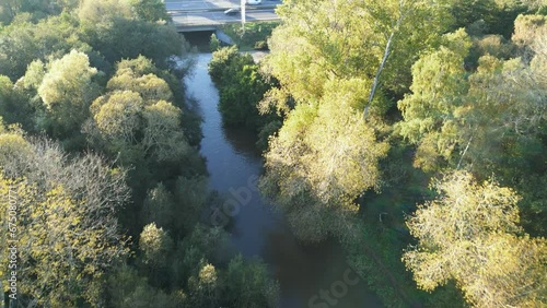 Fly Over High-Level Water Of River Thet With Dense Vegetation In Norfolk, England. Aerial Drone Shot photo