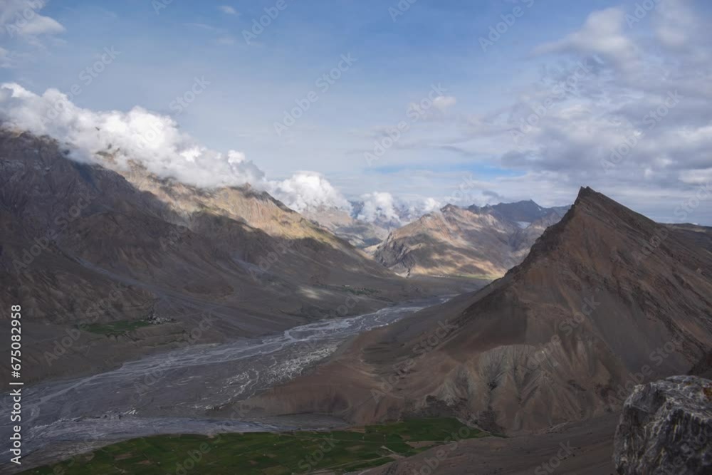 Time-lapse view of moving clouds above rough landscapes Time-lapse view of moving clouds above rough landscapes