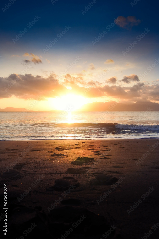 Beautiful golden sunrise, sands and blue sky on the beach. Beautiful golden sunrise, sands and blue sky on the beach.