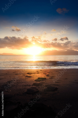 Beautiful golden sunrise  sands and blue sky on the beach.