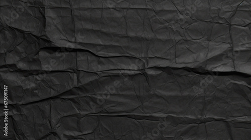 Dark black grey paper background creased crumpled surface , Old torn ripped posters scary grunge textures, top view black paper surface