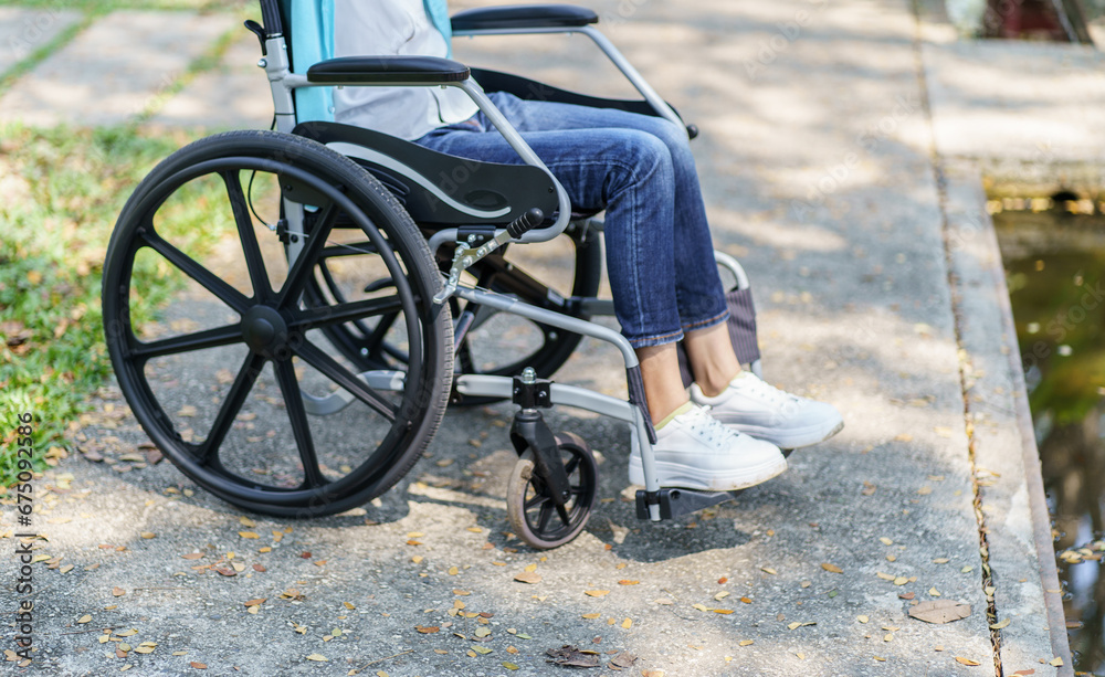 Obraz premium Depressed sad asian woman in wheelchair&nbsp;lonely disabled adult