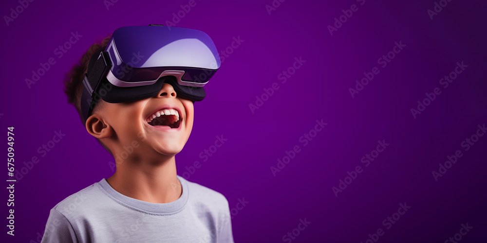Young boy getting experience using VR headset glasses isolated on a purple background with copy space Young boy getting experience using VR headset glasses isolated on a purple background with copy space