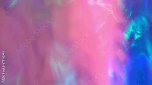 Hypnotic Neon Glow. Retro-futuristic blaze of blue, pink, purple, and teal. Abstract hypnotic background. Soft rainbow color holographic iridescent gradient photo