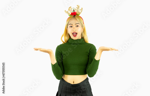 young asian woman wears a reindeer headband for christmas concept isolated on white background