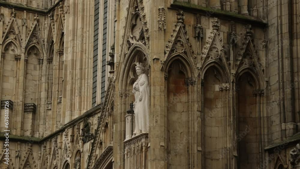 Hand-held shot of a Queen Elizabeth statue on York Minster, England Hand-held shot of a Queen Elizabeth statue on York Minster, England