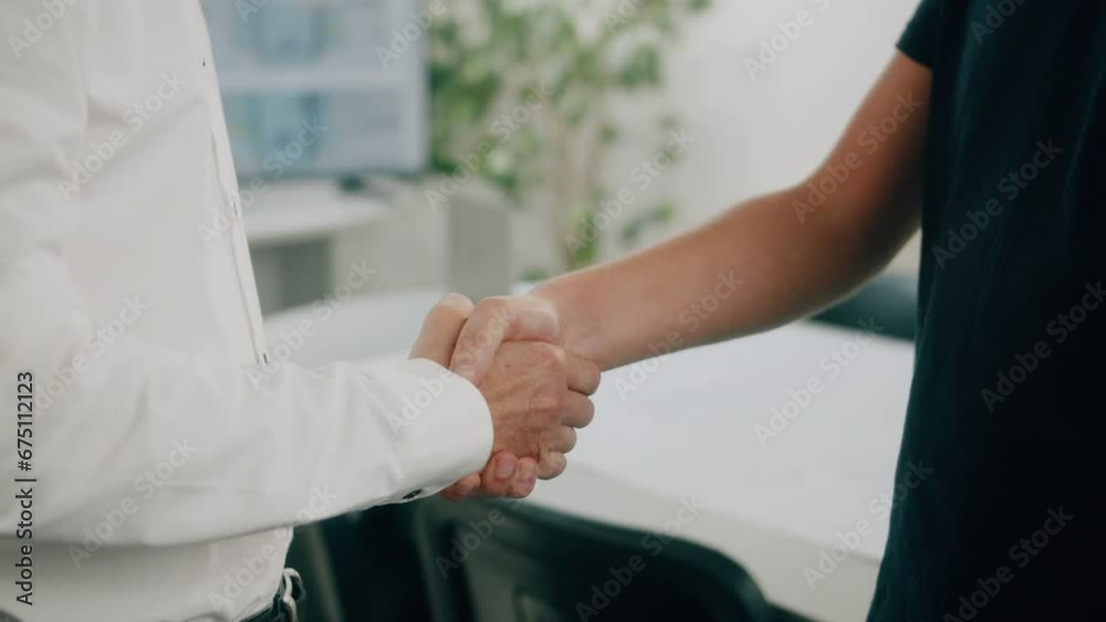Two businessmen shaking hands after a successful meeting Two businessmen shaking hands after a successful meeting