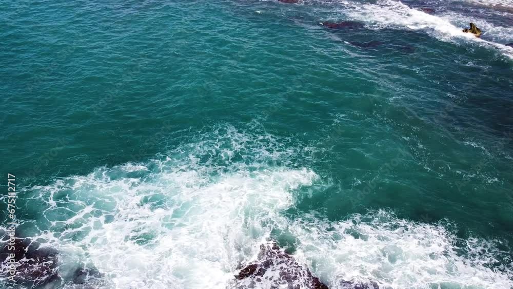 Foamy waves hitting rocky coast of Crete, aerial view Foamy waves hitting rocky coast of Crete, aerial view