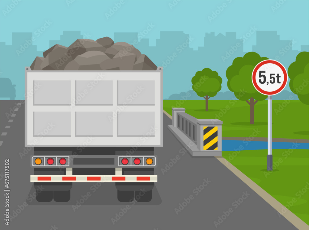 Heavy goods vehicles driving tips and rules. Back view of a loaded dump truck at bridge with 