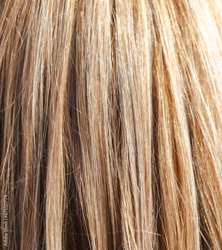 Straight female blonde hair background. Texture