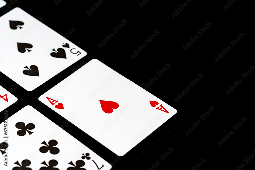 Playing cards on black background studio shot