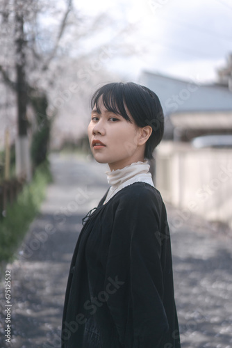 Portrait beautiful japanese woman with short hair sakura tree background