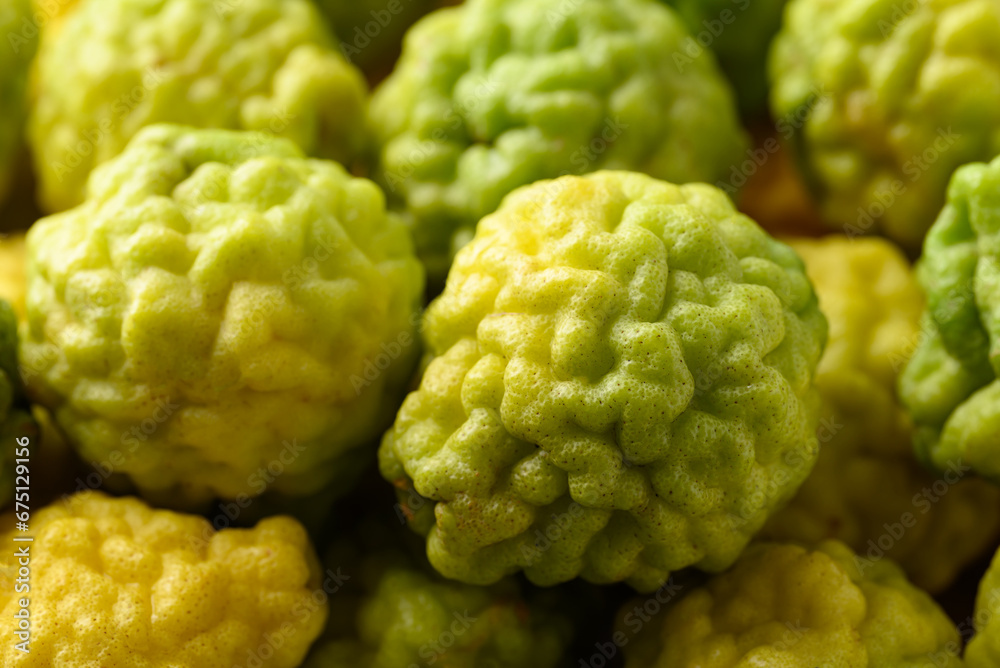 Fototapeta premium Kaffir lime fruit background, Organic ingredients in Thai cuisne, beauty and cosmetics