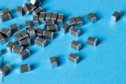 smd ceramic capacitors, on a blue table, electronic component photo