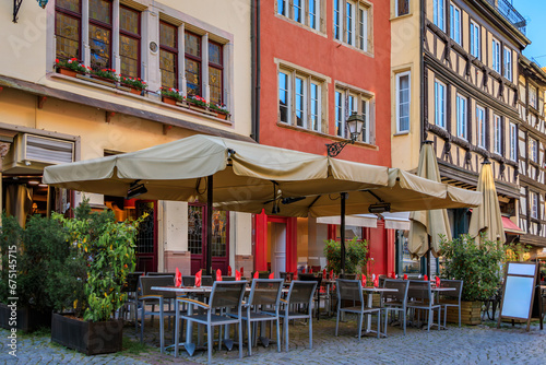 Canvas Print Outdoor tables at a an outdoor Alsatian winstub restaurant in a traditional half