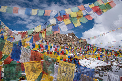 The beautiful views of Colorful Tibetan prayer flags on Khardung La or Khardung Pass photo