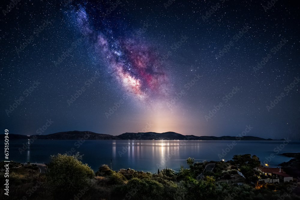 Fototapeta premium Milky Way over Hydra island in Greece