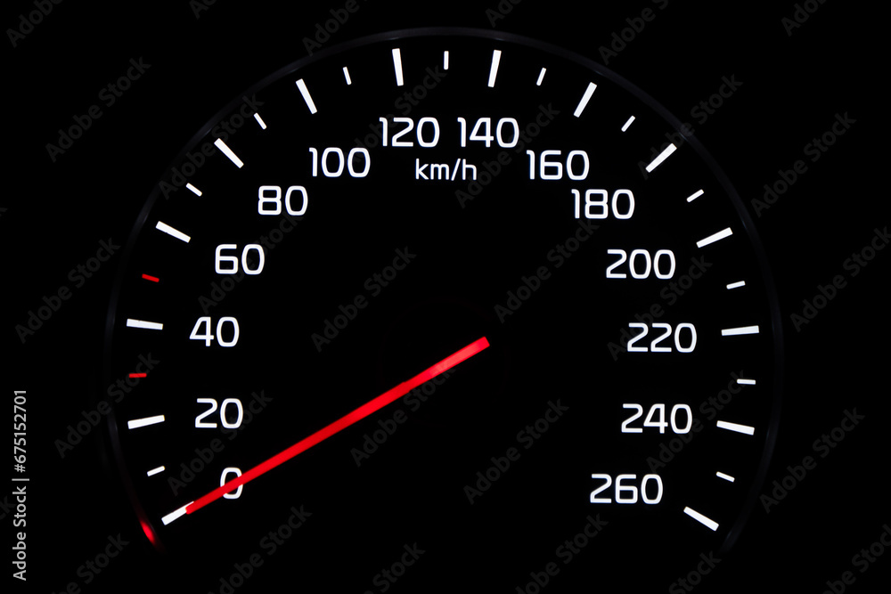 Close up shot of speedometer in car. Car dashboard. Dashboard details with indication lamps.Car instrument panel. Dashboard with speedometer isolated on black background
