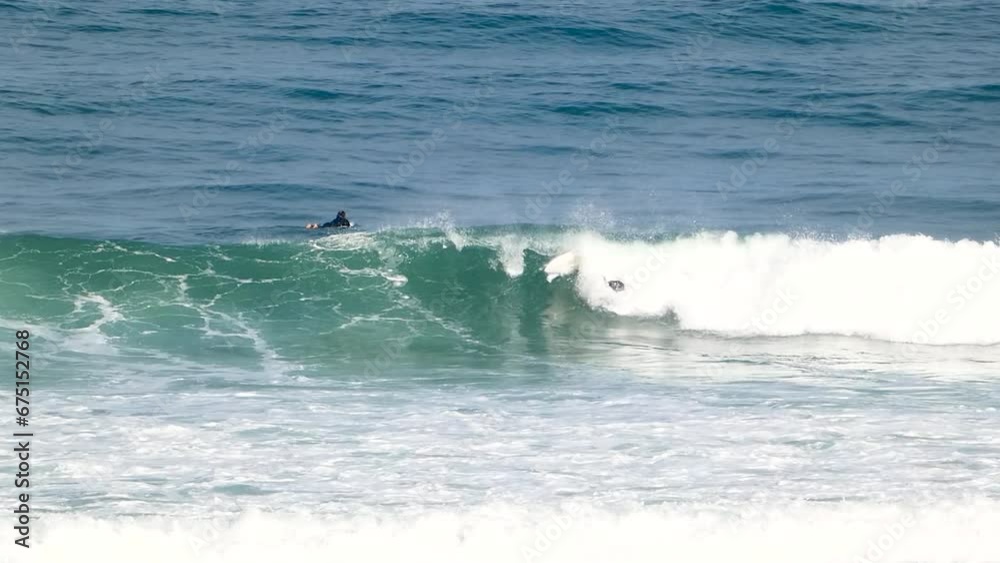 close view of Surfer attempting a backside takeoff and failing when hitting the lip. close view of Surfer attempting a backside takeoff and failing when hitting the lip.
