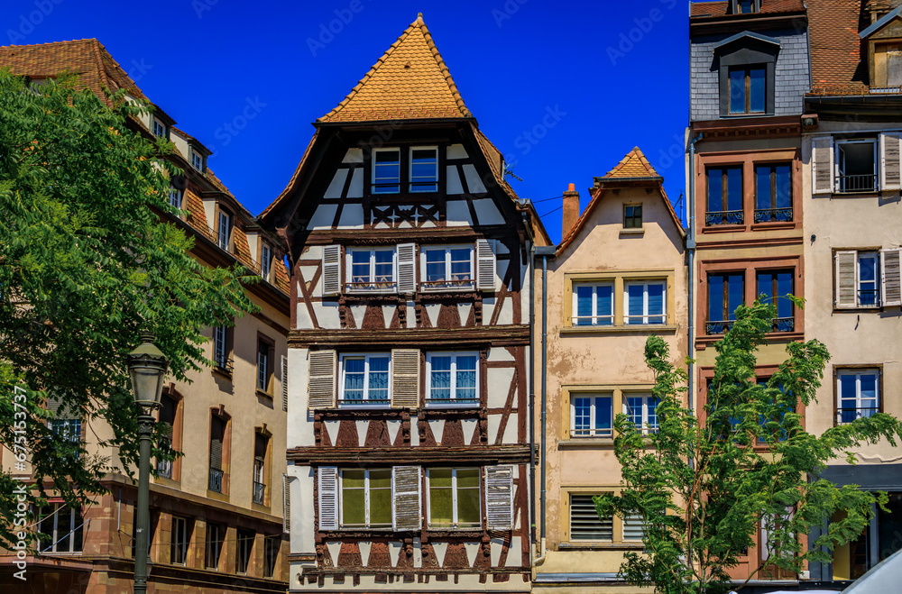 Ornate traditional half timbered houses in the Carre d Or, historical district with shops and restaurants by the Strasbourg Cathedral, Alsace, France