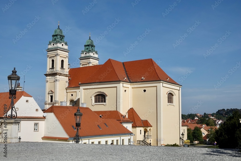 Obraz premium Church of the Assumption of the Virgin Mary in Valtice, South Moravia, Czech Republic. View from Valtice castle to the side of the church. High quality photo