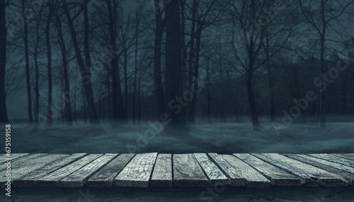 Old wooden pier and creepy forest at night