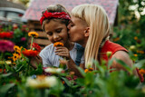 Mom and daughter bonding over beautiful flowers in the countryside