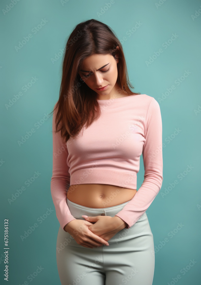 sad young woman holding her stomach, illness, cramps, health, color background, girl suffering, painful periods, stomach-ache, abdominal, griping, bellyache, tummy-ache, gripes, portrait, ill, pastel sad young woman holding her stomach, illness, cramps, health, color background, girl suffering, painful periods, stomach-ache, abdominal, griping, bellyache, tummy-ache, gripes, portrait, ill, pastel