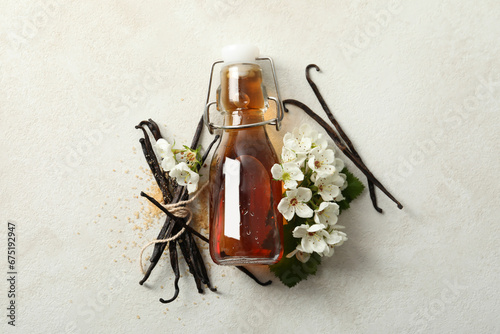 Vanilla extract in a bottle on a white background photo