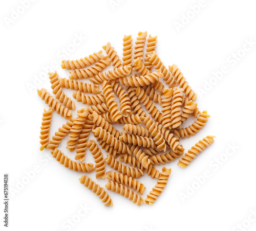 Raw whole grain fusilli pasta. Uncooked pasta isolated on white background.