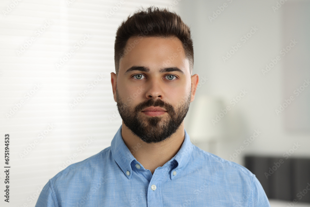 Fototapeta premium Portrait of handsome young man in shirt indoors