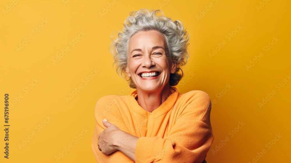 Senior Caucasian Woman Expressing Self-Love and Contentment with a Joyful Self-Hug