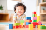 Happy cute toddler playing on floor with colorful wooden block toys. Learning by playing concept. 