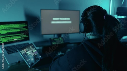 Young woman hacker using computer breaks into government data servers and infects their systems with a virus. Security password login technology business concept. Hacker concept photo