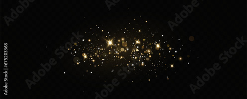 Golden sequins glow with many lights. Glittering dust. Luxurious background of golden particles.