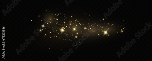 Golden sequins glow with many lights. Glittering dust. Luxurious background of golden particles.