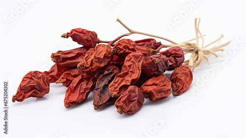 A handful of dried rose hips on a white background.
