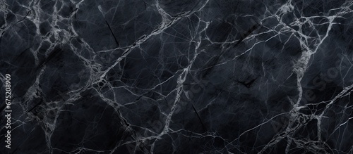 The black grunge wallpaper with an abstract pattern of natural marble adds a unique texture to the background design making it an eye catching element on the wall or floor of any architectu