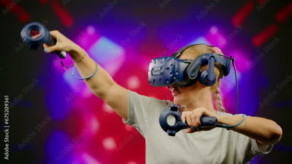 The beautiful woman wearing VR headset dancing in virtual reality. The